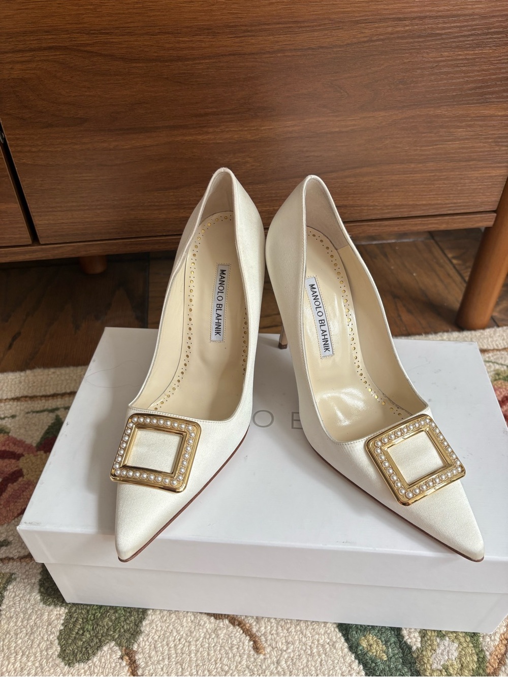 Manolo Blahnik Ivory Satin Pointed Toe Pumps with Gold Pearl-Embellished Buckles